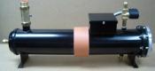 A black pen with pink tape on it.
