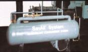 A large metal tank sitting on top of a cement floor.