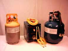 Three propane tanks are sitting on a table.